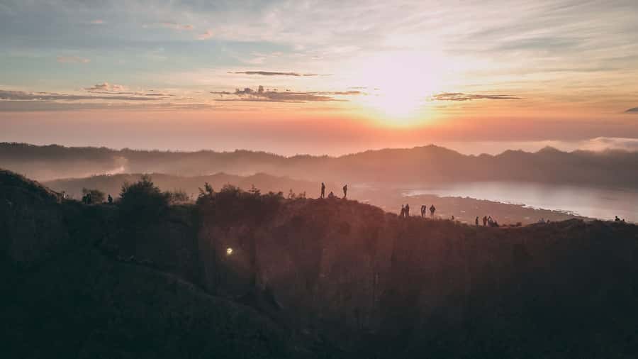 Bali: Mount Batur Sunset Trek with Picnic - Walking through the caldera and black lava