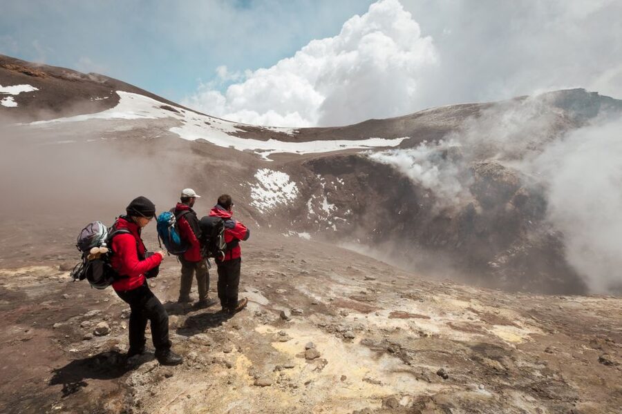 Catania: Mount Etna Trekking Tour Beyond the Tourist Trails - The volcanic-sand descent and lava cave