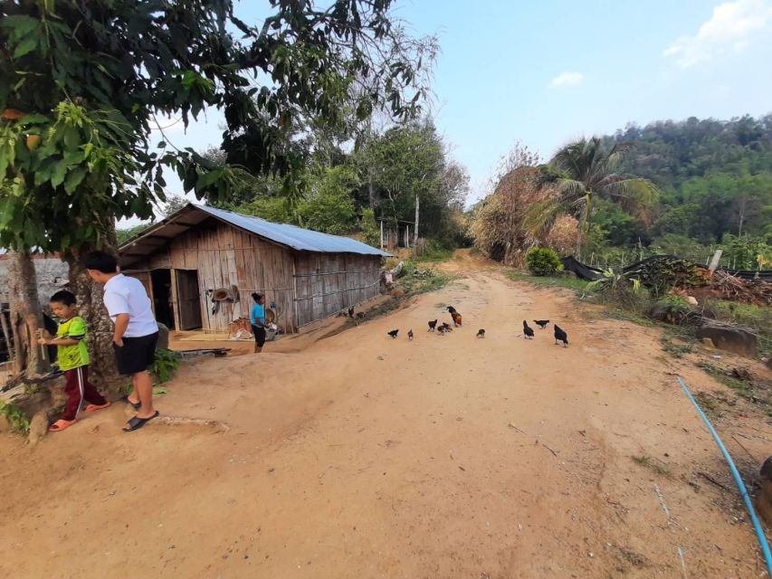 Chiang Rai 1 Day Jungle Trek with Bamboo Lunch & Local Guide - Cooling off at Huai Kaeo Waterfall