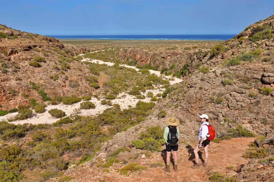 Exmouth: Cape Range Explorer One-Day Trekking Adventure - Walking into Cape Range’s red gorges