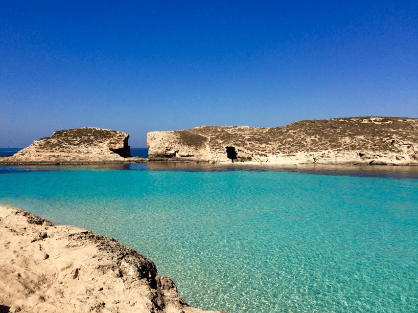 Fisher’s Trek: Cominotto Island, Prime Fishing Spots & Gozo - Comino’s caves, coves, and bright blue water