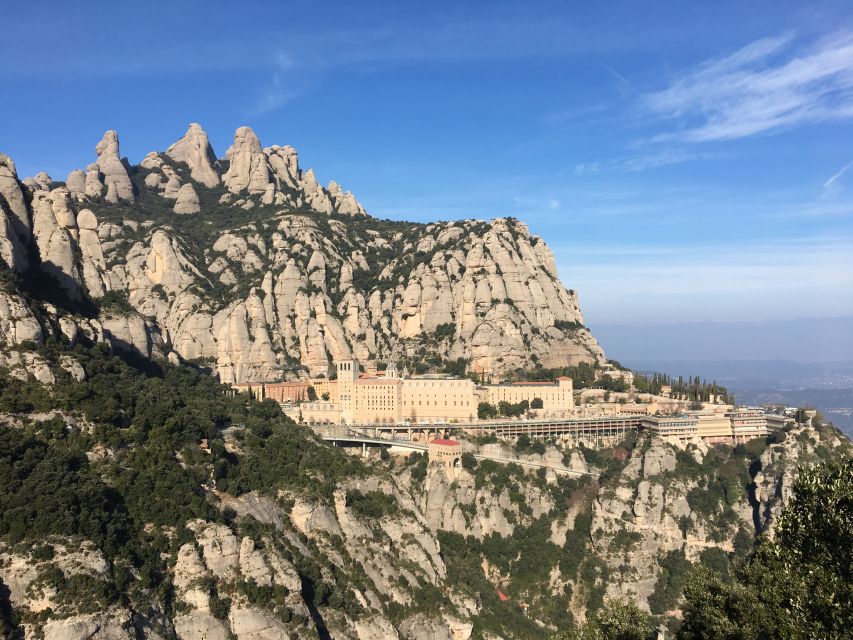 From Barcelona: Montserrat Monastery & Scenic Mountain Hike - Riding the funicular above the monastery