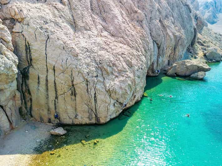 Kayak and Via Ferrata Adventure - Slana Bay and its flat rocks above the water