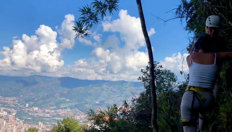 Medellin: Day Trip to Private Zipline and Waterfall Trek - Crossing the river to the rock wall