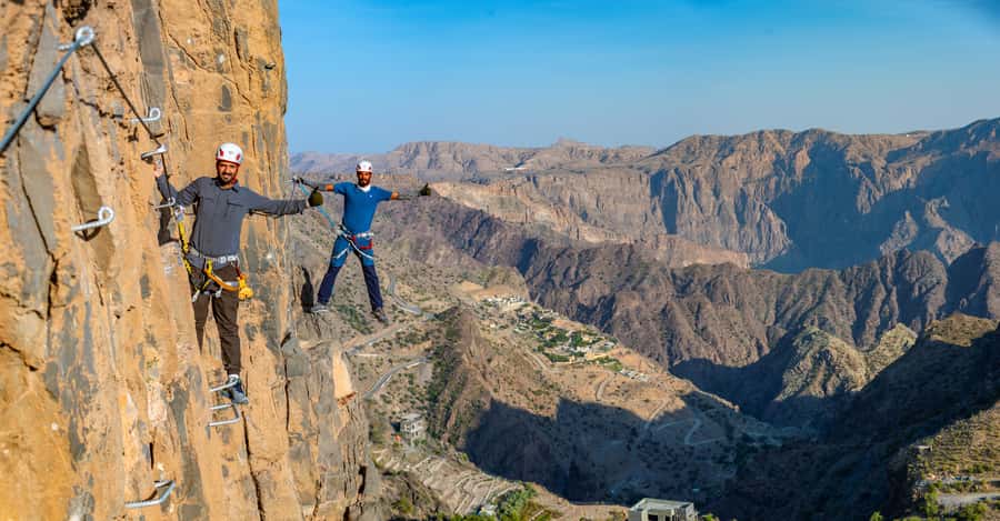 Nizwa: Jebel Shams Balcony Walk and Via Ferrata Adventure - Walking the Balcony Walk toward the hidden pool