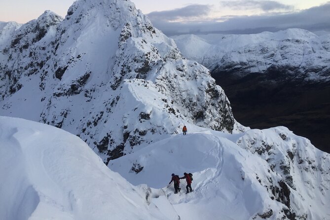Private Guided Winter Mountaineering Experience in the Cairngorms - Roped climbing below the frozen cliffs