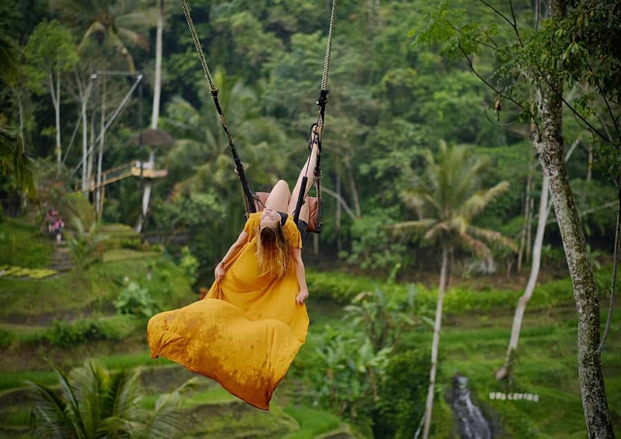 Ubud: Rice Terrace, Holy Water Temple & Waterfalls Trek Tour - Kanto Lampo Waterfall: photographs and slippery stones
